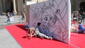 Danjer pintando la obra 'Baile de Máscaras'